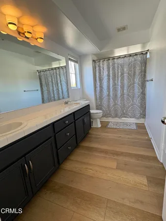 a spacious bathroom with a bathtub and a shower