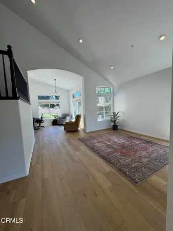 a view of a livingroom with furniture and a rug