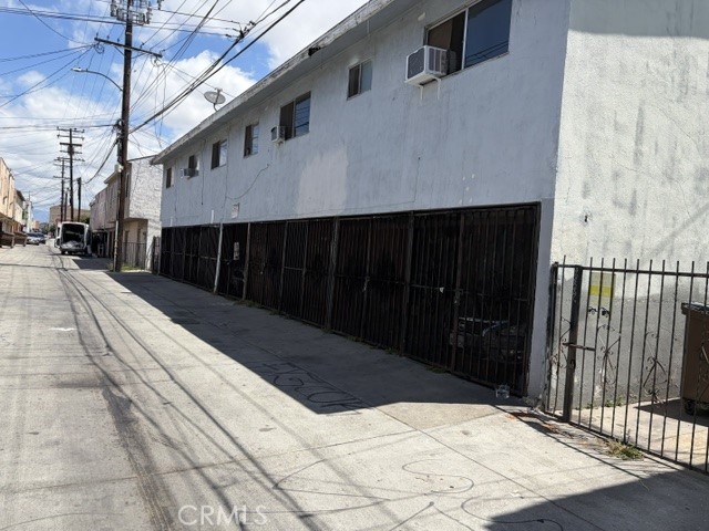 7015 Rugby Avenue Huntington Park, CA 90255 - Photo 3 of 3 Alley view behind the building, showing rear entrance and garages.