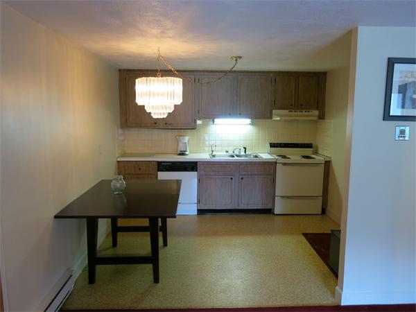 13 Walker Road, Unit 6 North Andover, MA 01845 - Photo 3 of 16 a kitchen with a sink cabinets and window
