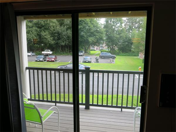 13 Walker Road, Unit 6 North Andover, MA 01845 - Photo 8 of 16 a view of a balcony with floor to ceiling windows