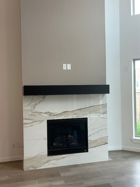 4418 Heather Xing Road Fulshear, TX 77441 - Photo 5 of 22 Gas fireplace with a floating mantel is a focal point in the family room.