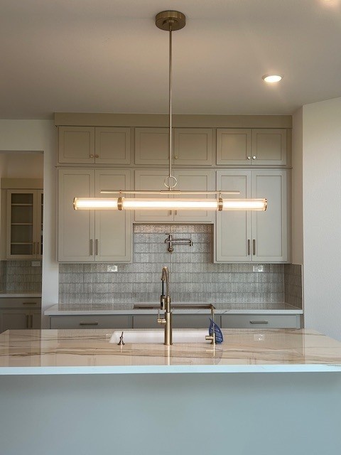 4418 Heather Xing Road Fulshear, TX 77441 - Photo 7 of 22 Modern pendent lighting plus the pot filler is a cook's dream kitchen