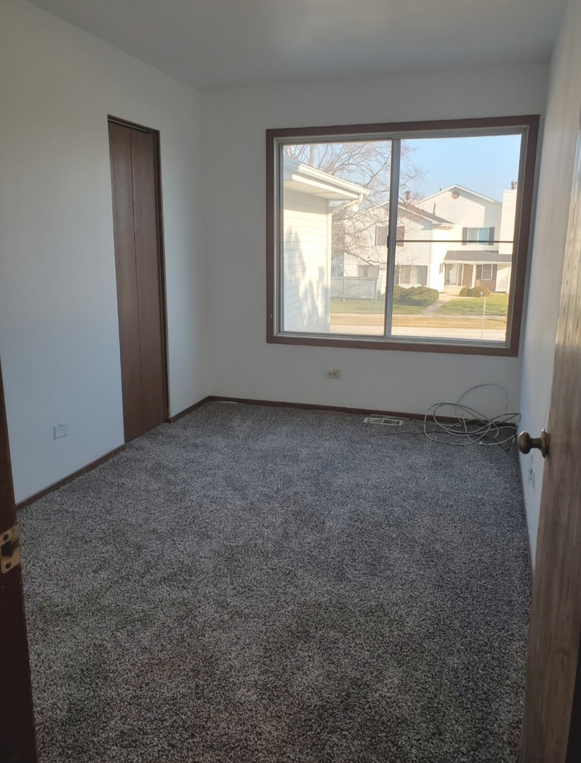 54 Churn Road Matteson, IL 60443 - Photo 11 of 19 an empty room with a window