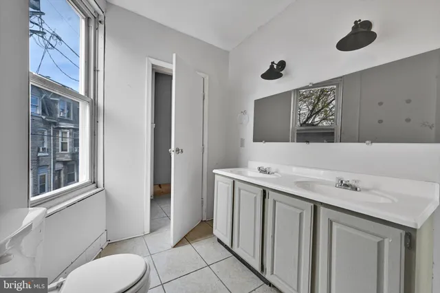 a bathroom with a sink and mirror