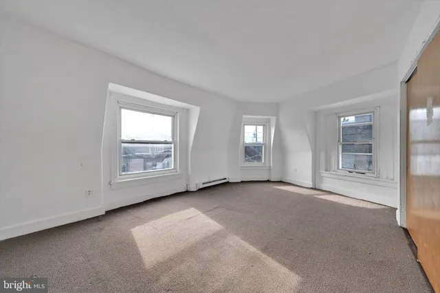 an empty room with windows