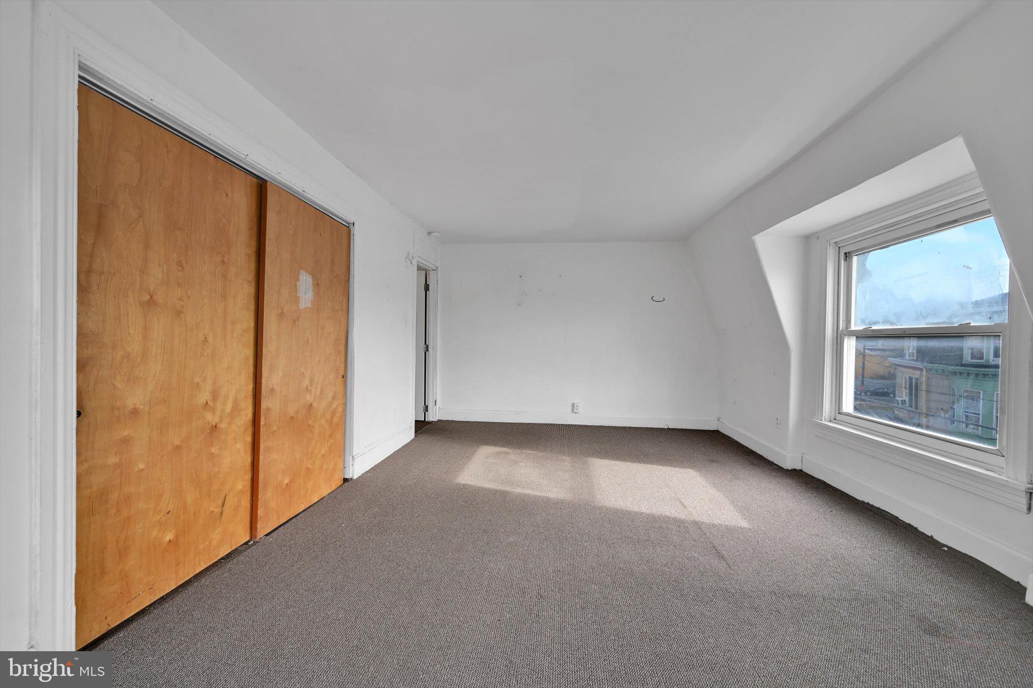 525 Bingaman Street Reading, PA 19602 - Photo 19 of 27 a view of a livingroom with an empty space and a window