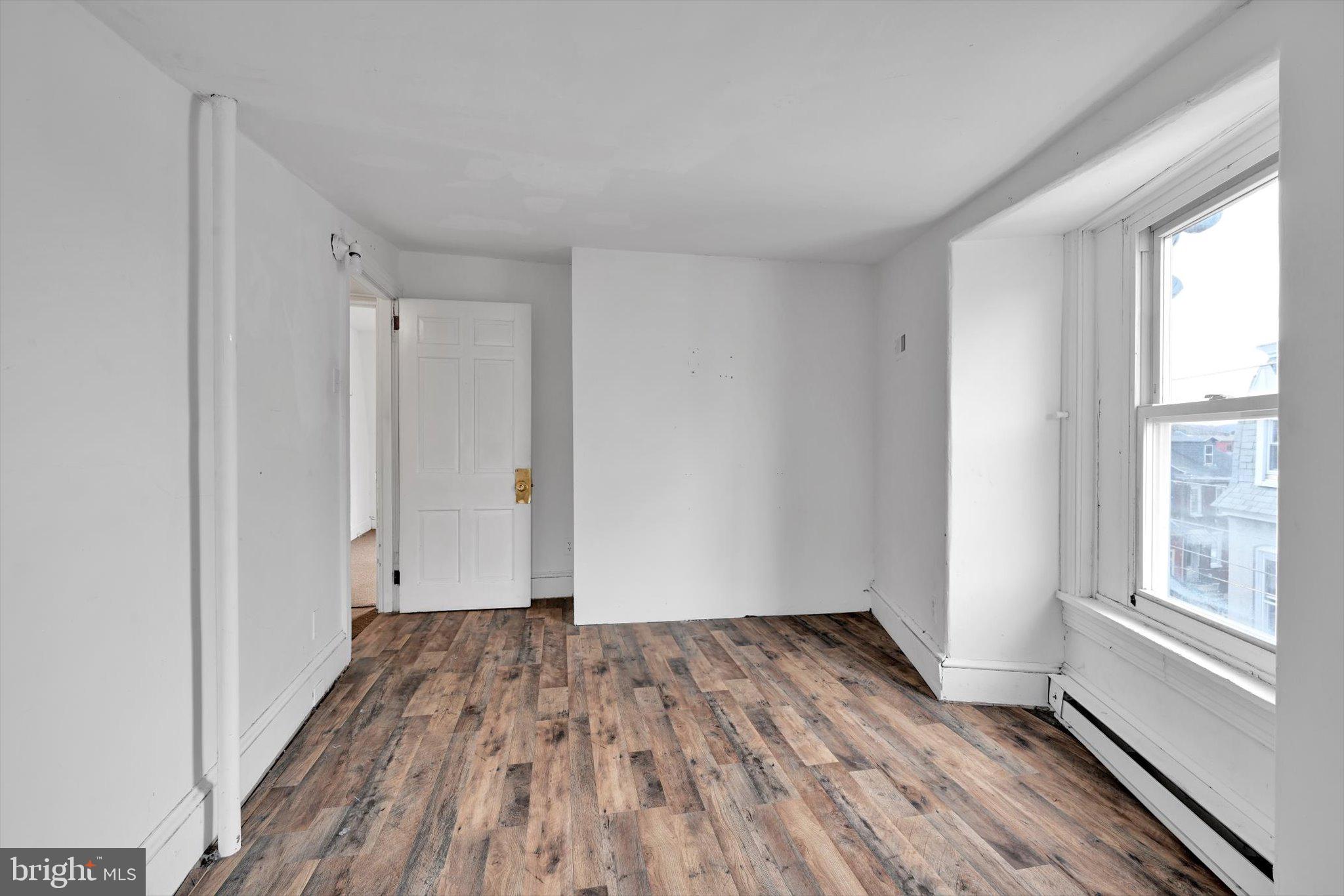 525 Bingaman Street Reading, PA 19602 - Photo 22 of 27 a view of a room with wooden floor and window