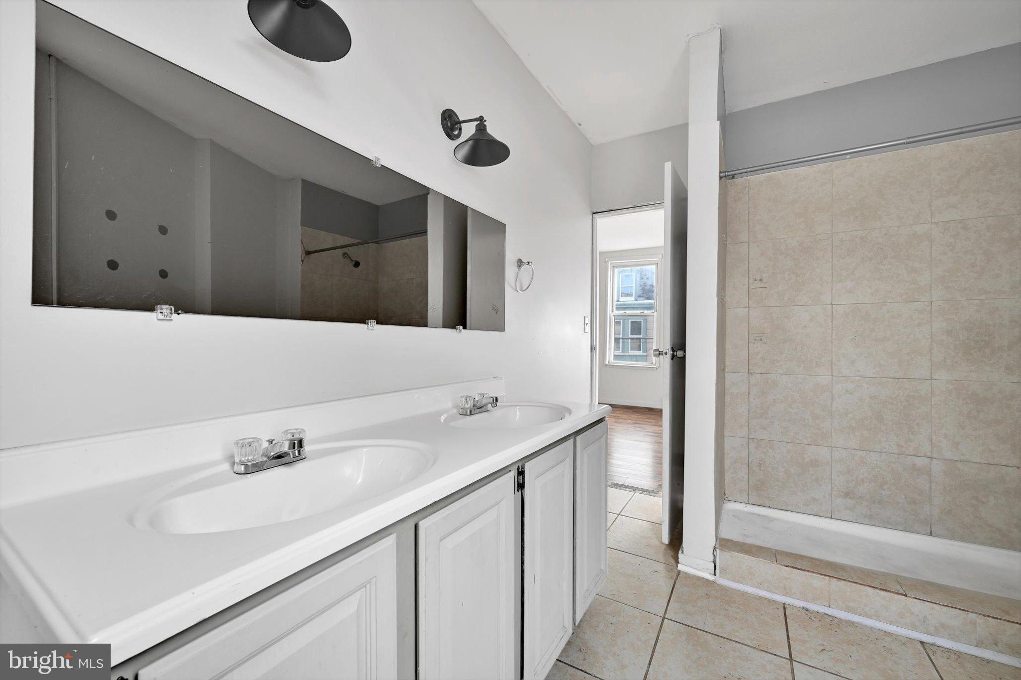 525 Bingaman Street Reading, PA 19602 - Photo 23 of 27 a bathroom with a sink and a mirror