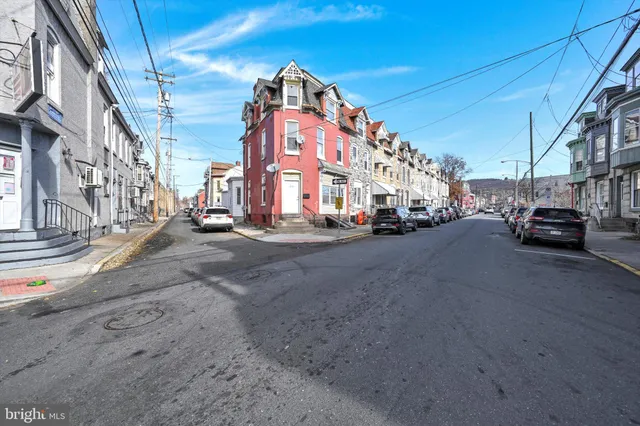 a view of a street with cars