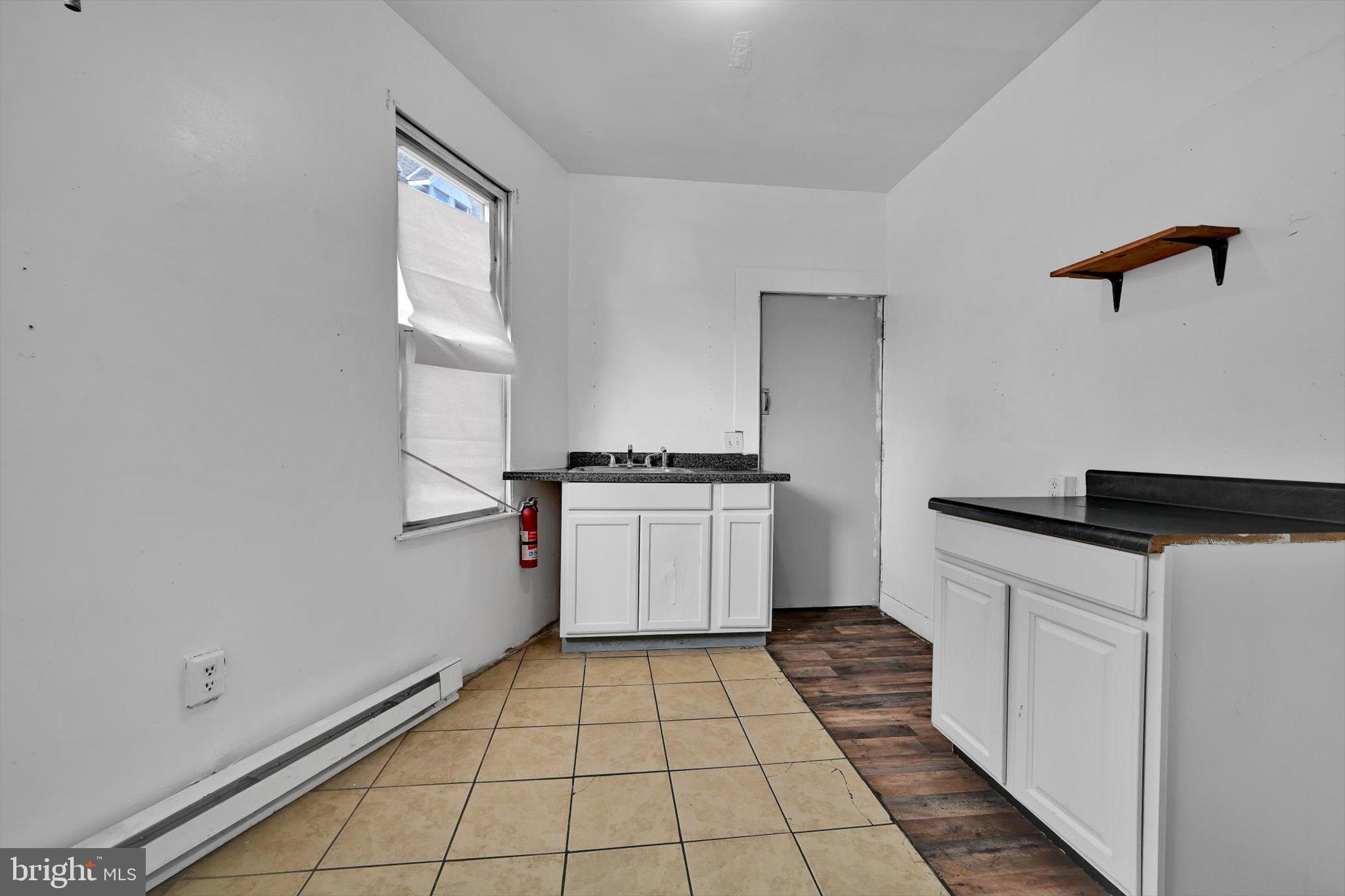 525 Bingaman Street Reading, PA 19602 - Photo 10 of 27 a kitchen with a cabinets and white appliances