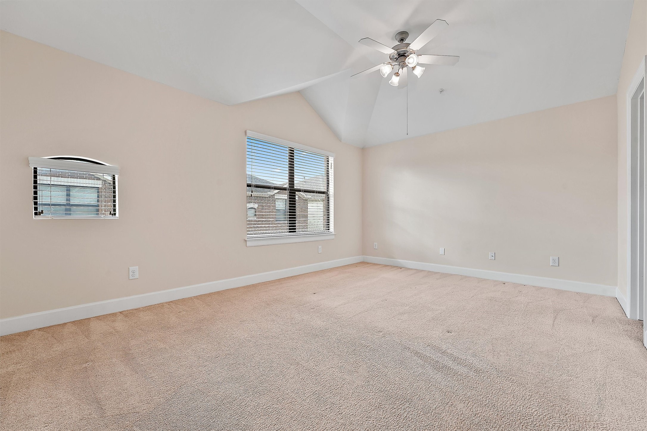 2710 Hullsmith Drive, Unit 903 Houston, TX 77063 - Photo 19 of 26 an empty room with windows and chandelier fan