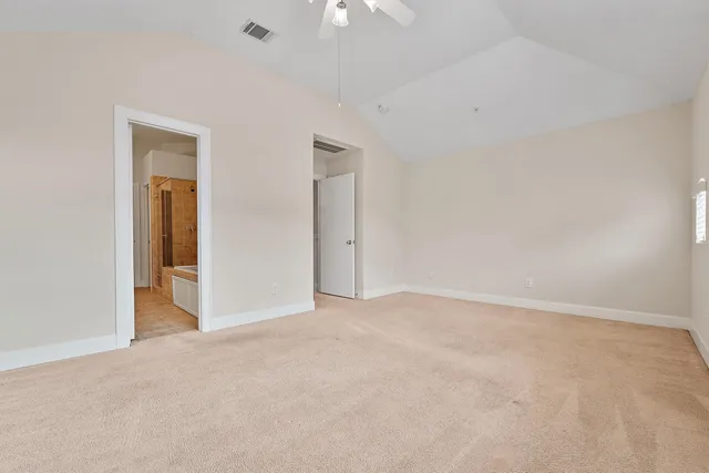 a spacious bathroom with a double vanity sink mirror and double