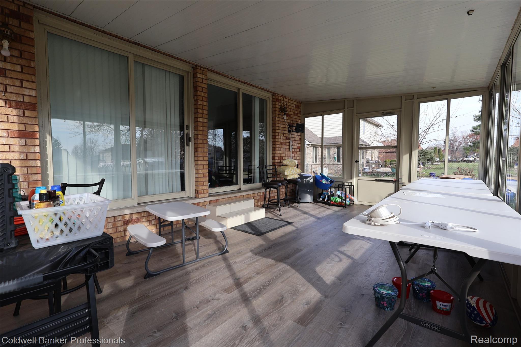 22305 King Road Trenton, MI 48183 - Photo 8 of 26 Sunroom with brick wall and wood finished floors (off of the family room)