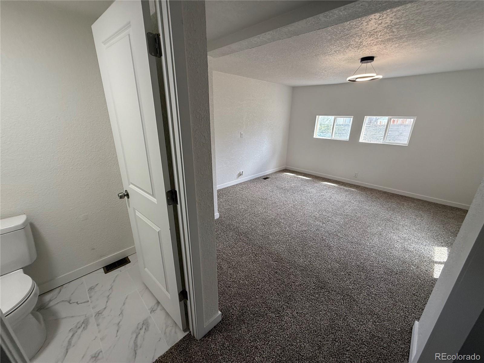 1045 Mac Davidson Circle Dacono, CO 80514 - Photo 20 of 32 a view of a bathroom