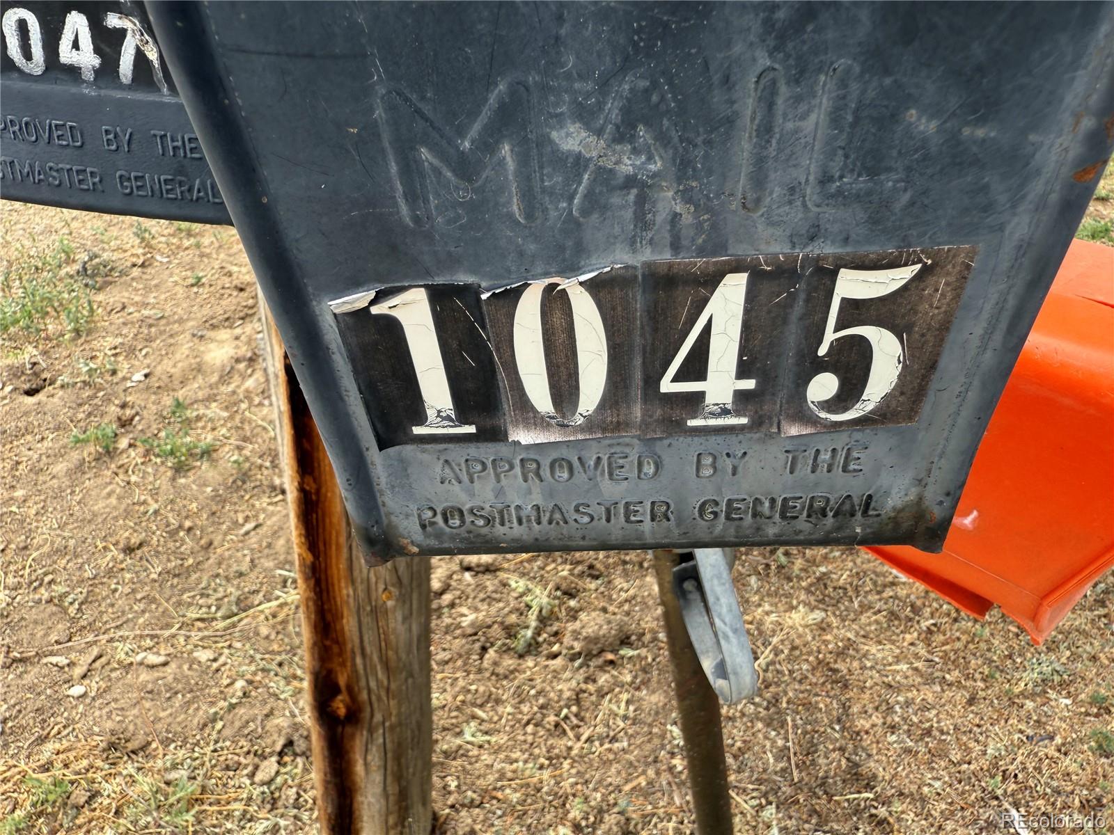 1045 Mac Davidson Circle Dacono, CO 80514 - Photo 31 of 32 a sign broad in front of a building