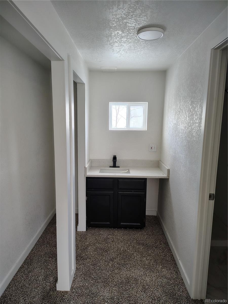 1045 Mac Davidson Circle Dacono, CO 80514 - Photo 6 of 32 a room with closet and mirror