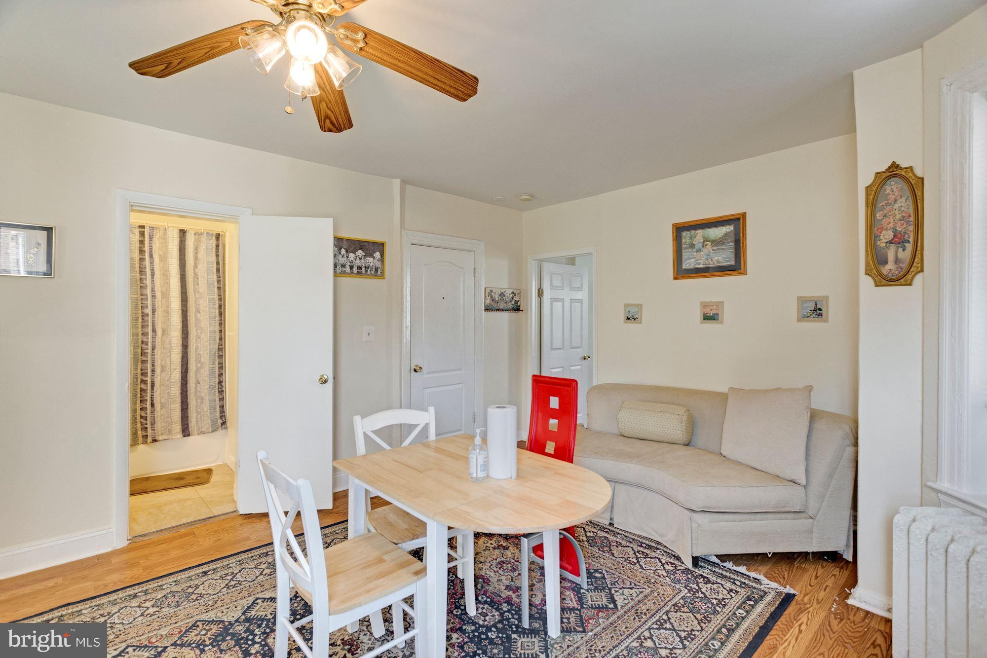 726 Rock Creek Church Road Northwest, Unit 2 Washington, DC 20010 - Photo 14 of 16 a living room with furniture and a rug