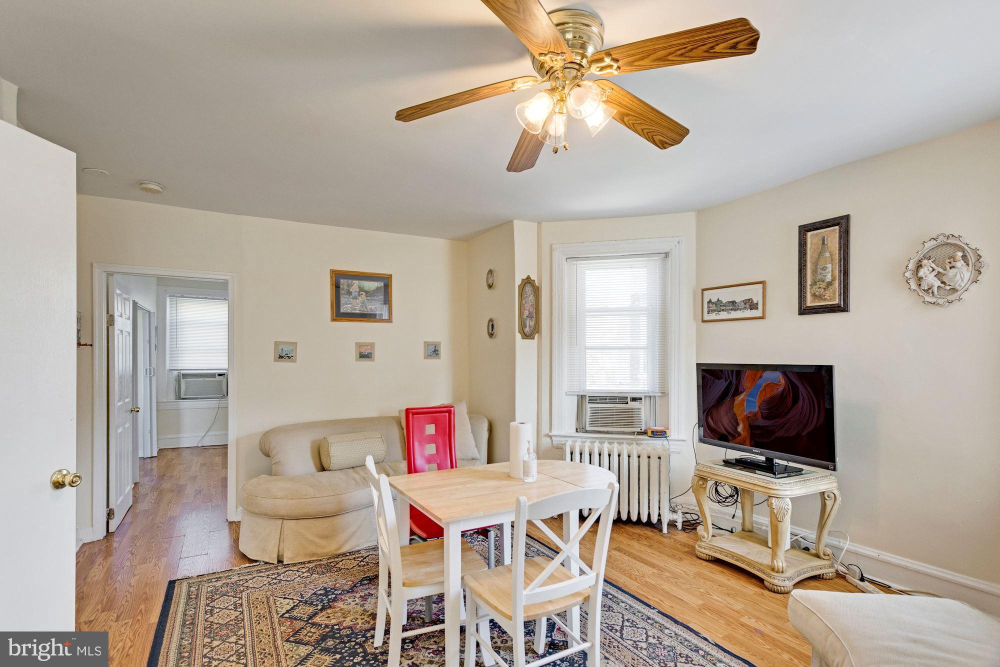 726 Rock Creek Church Road Northwest, Unit 2 Washington, DC 20010 - Photo 15 of 16 a living room with furniture and a flat screen tv