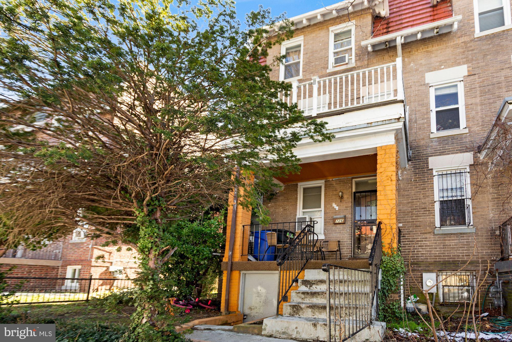 726 Rock Creek Church Road Northwest, Unit 2 Washington, DC 20010 - Photo 16 of 16 a front view of a house with a tree