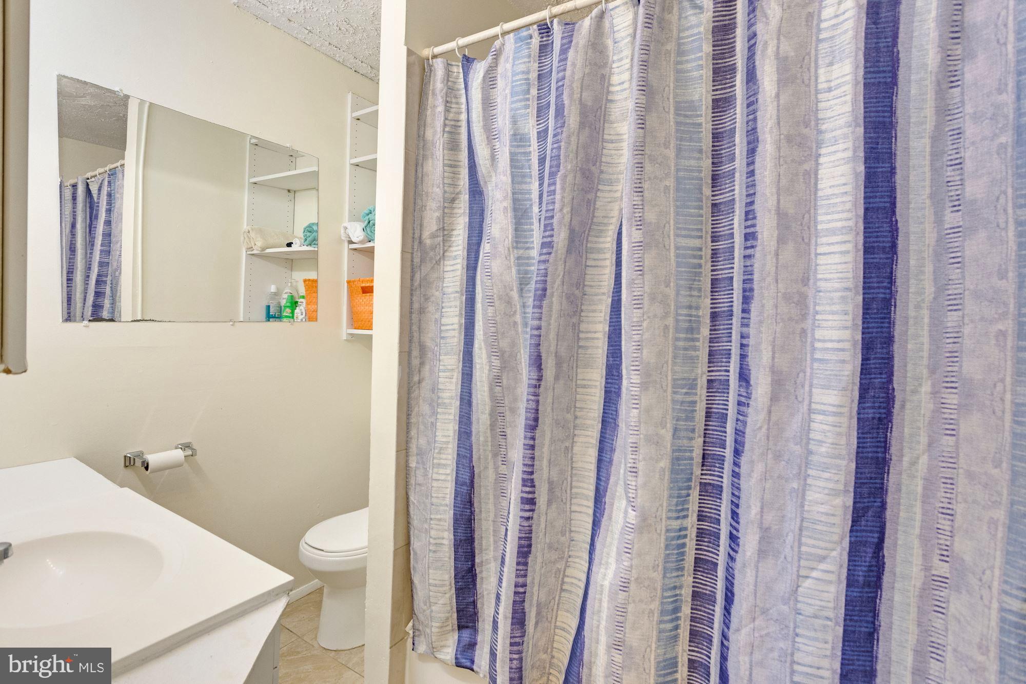 726 Rock Creek Church Road Northwest, Unit 2 Washington, DC 20010 - Photo 5 of 16 a white toilet sitting next to a bathroom sink