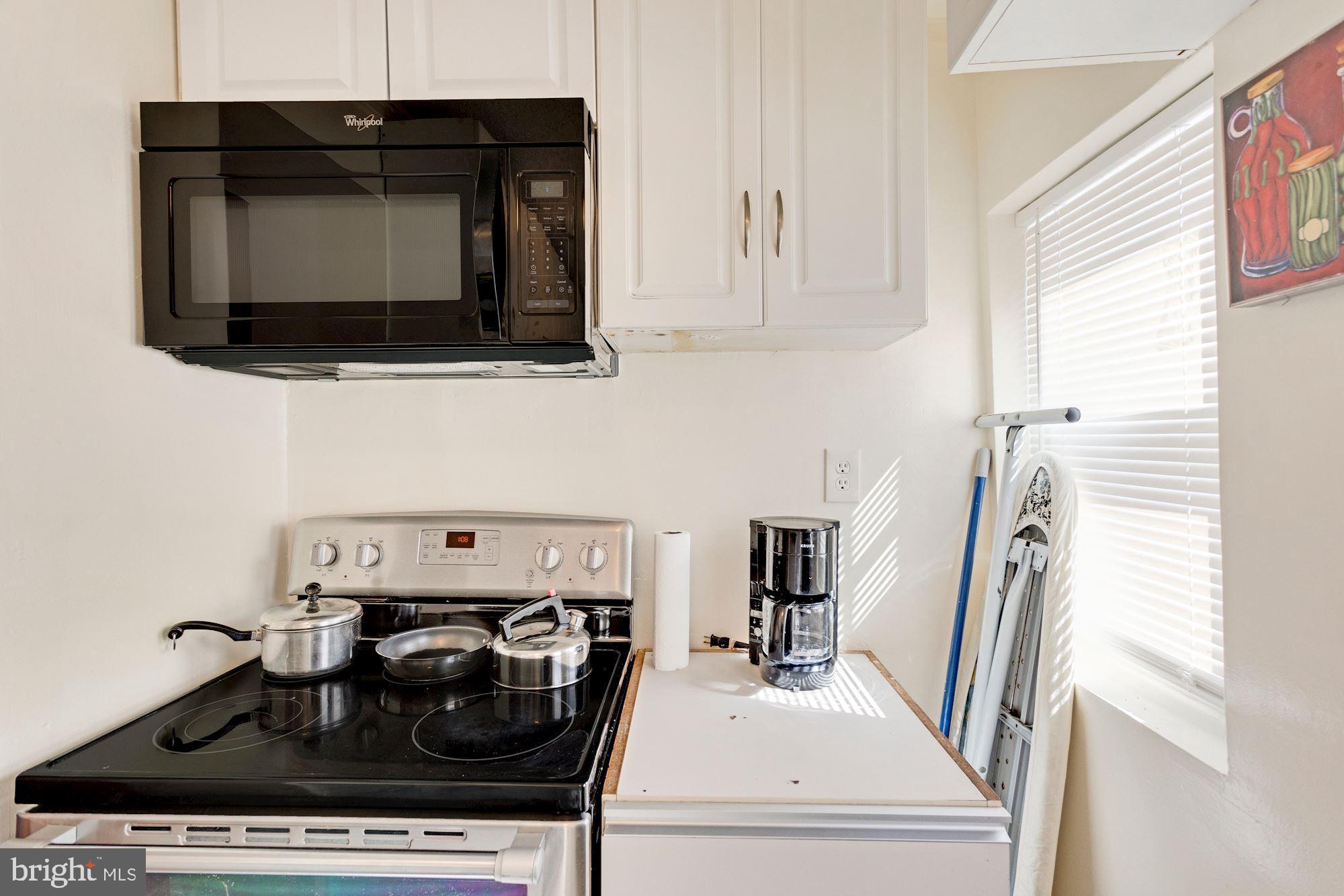 726 Rock Creek Church Road Northwest, Unit 2 Washington, DC 20010 - Photo 10 of 16 a utility room with a stove and a microwave