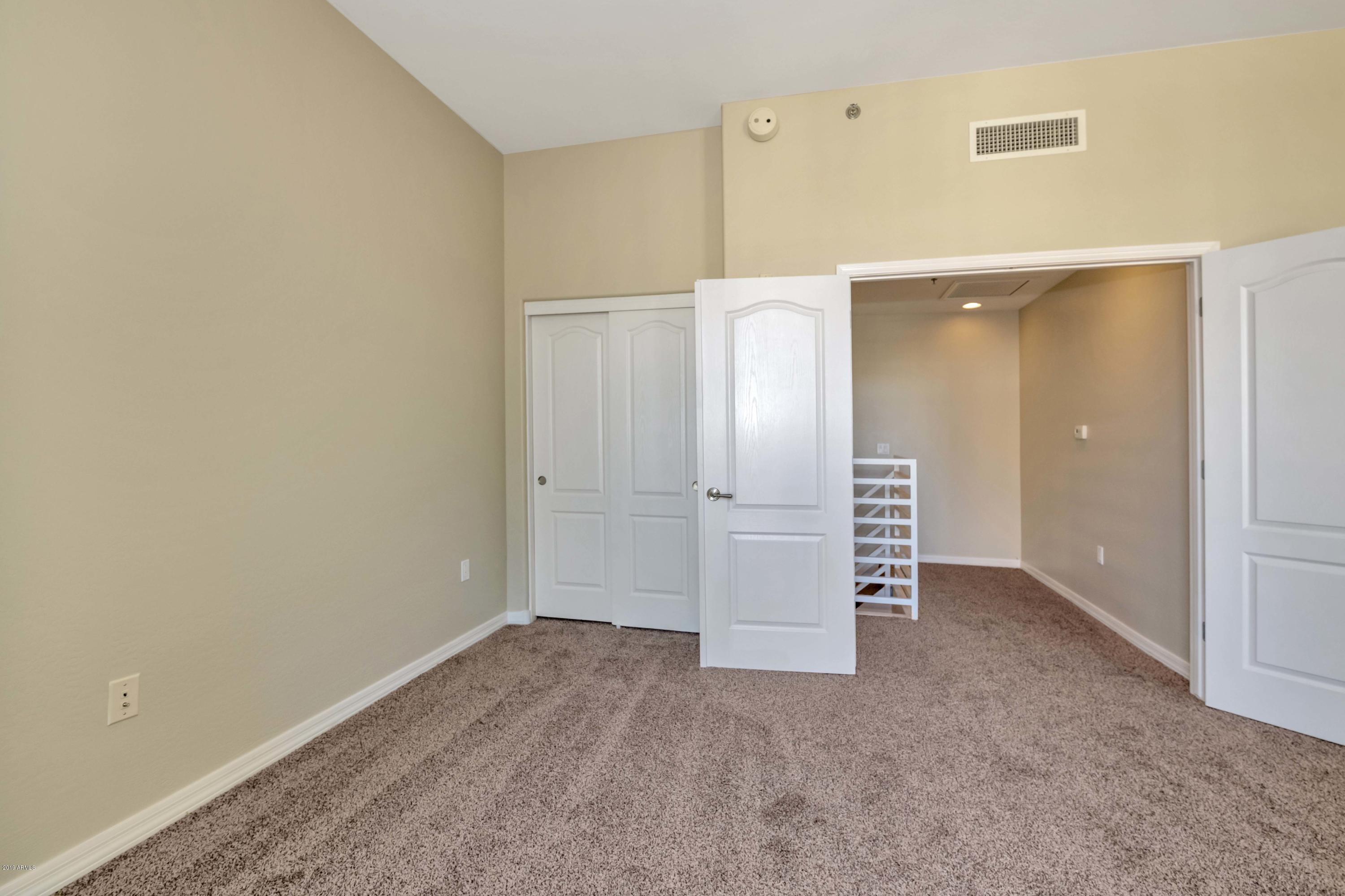 16 West Encanto Boulevard, Unit 615 Phoenix, AZ 85003 - Photo 13 of 33 wooden floor in an empty room