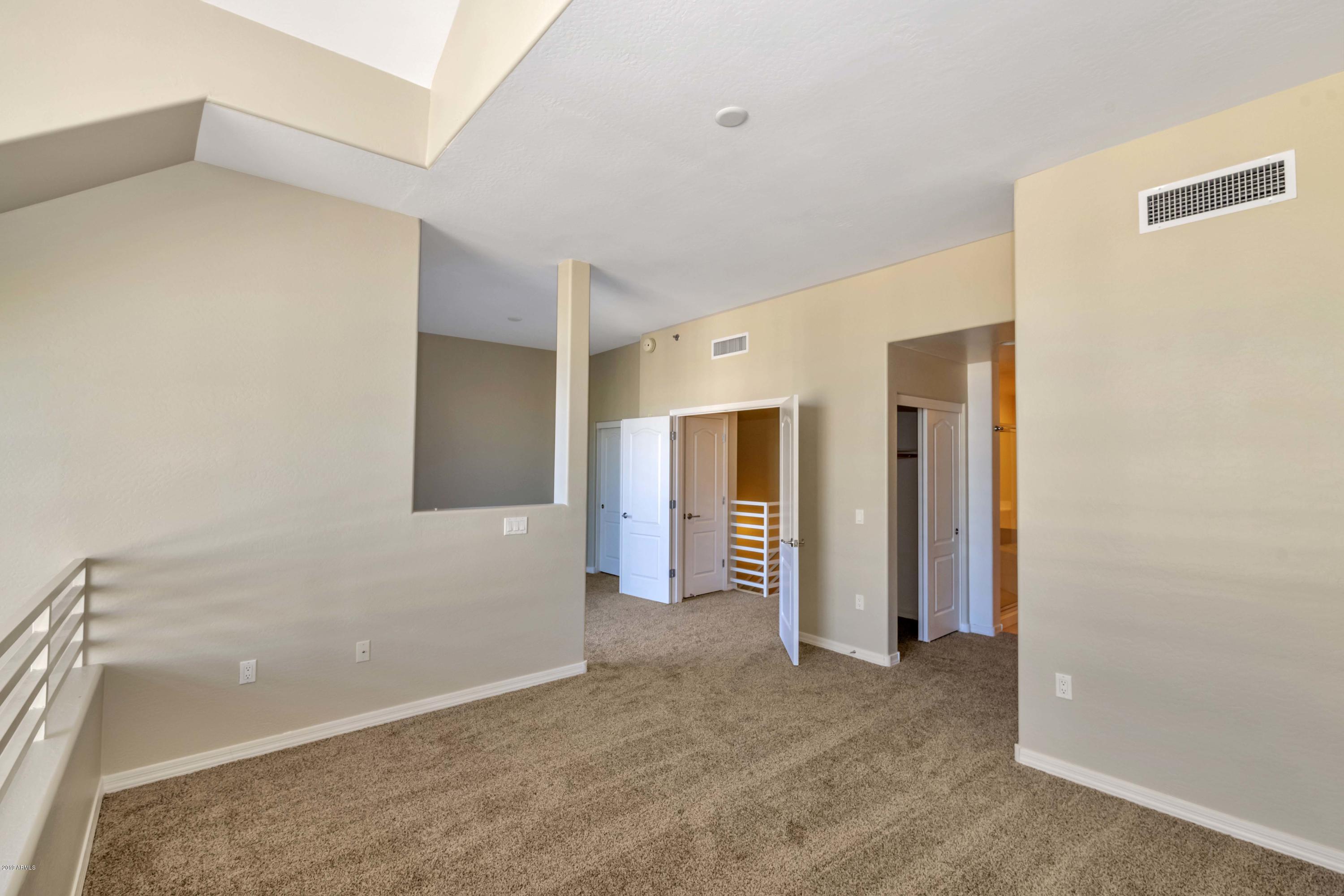 16 West Encanto Boulevard, Unit 615 Phoenix, AZ 85003 - Photo 14 of 33 a view of a big room with closet and windows