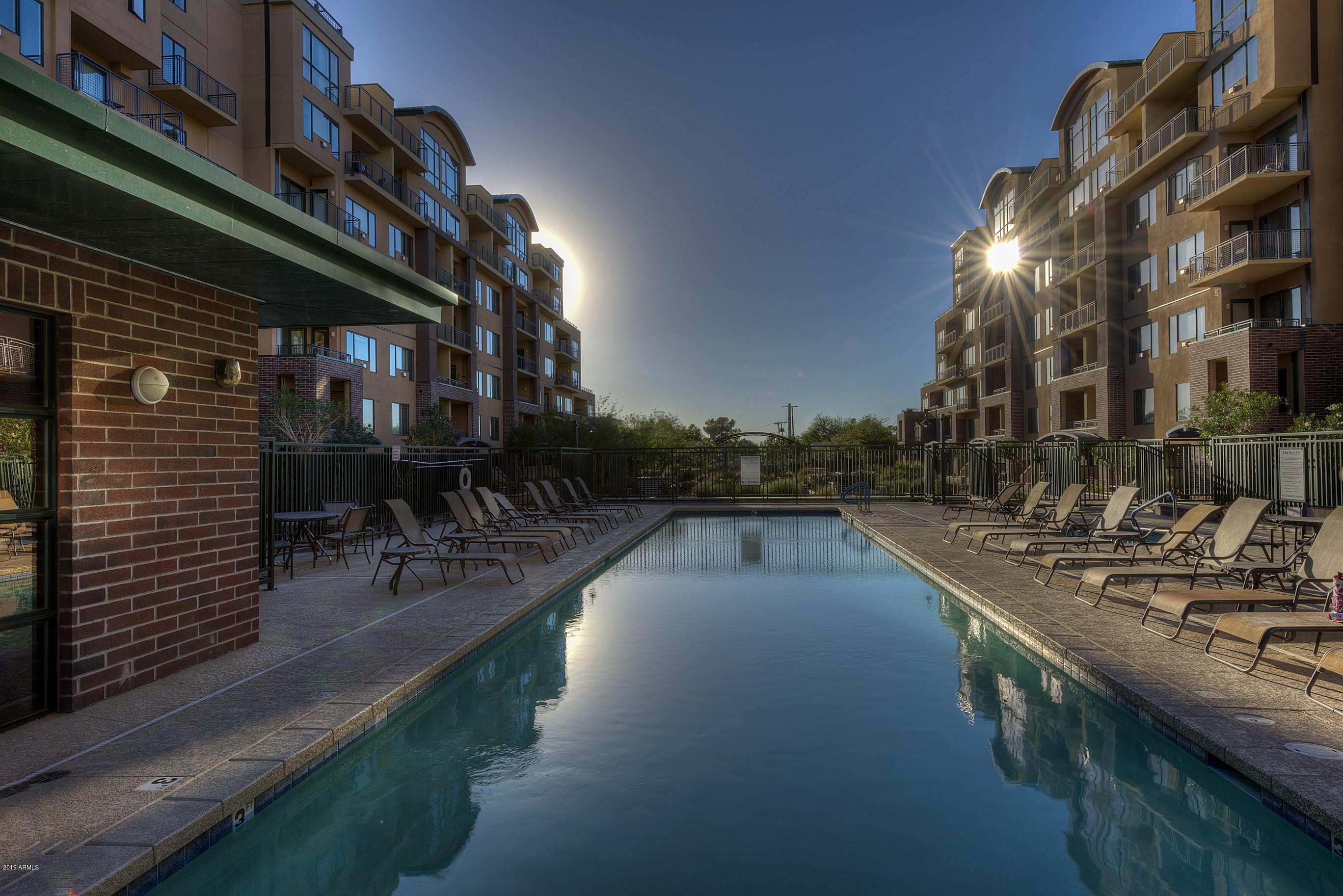 16 West Encanto Boulevard, Unit 615 Phoenix, AZ 85003 - Photo 29 of 33 a view of a swimming pool with outdoor seating