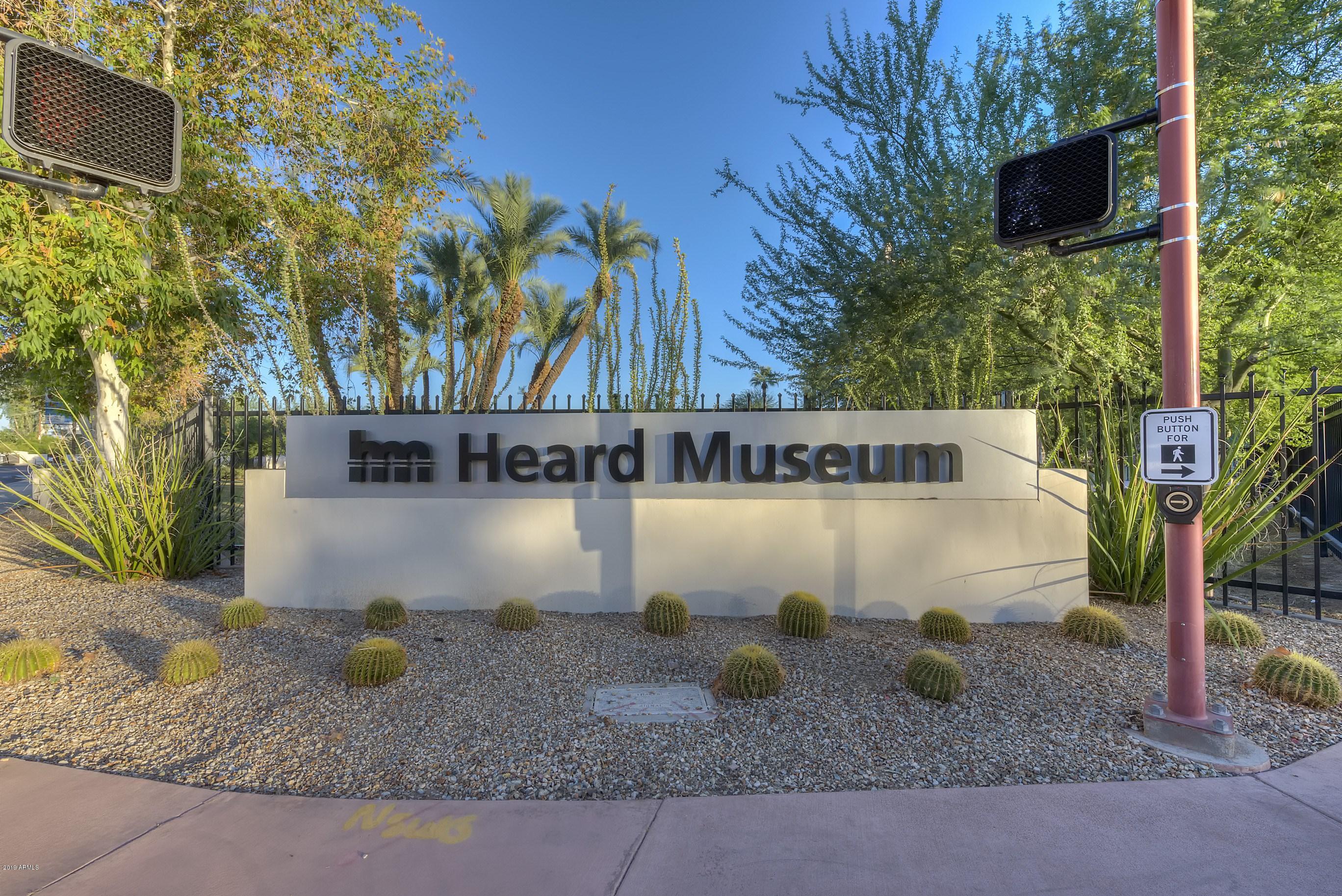 16 West Encanto Boulevard, Unit 615 Phoenix, AZ 85003 - Photo 32 of 33 a sign that is sitting in front of a house