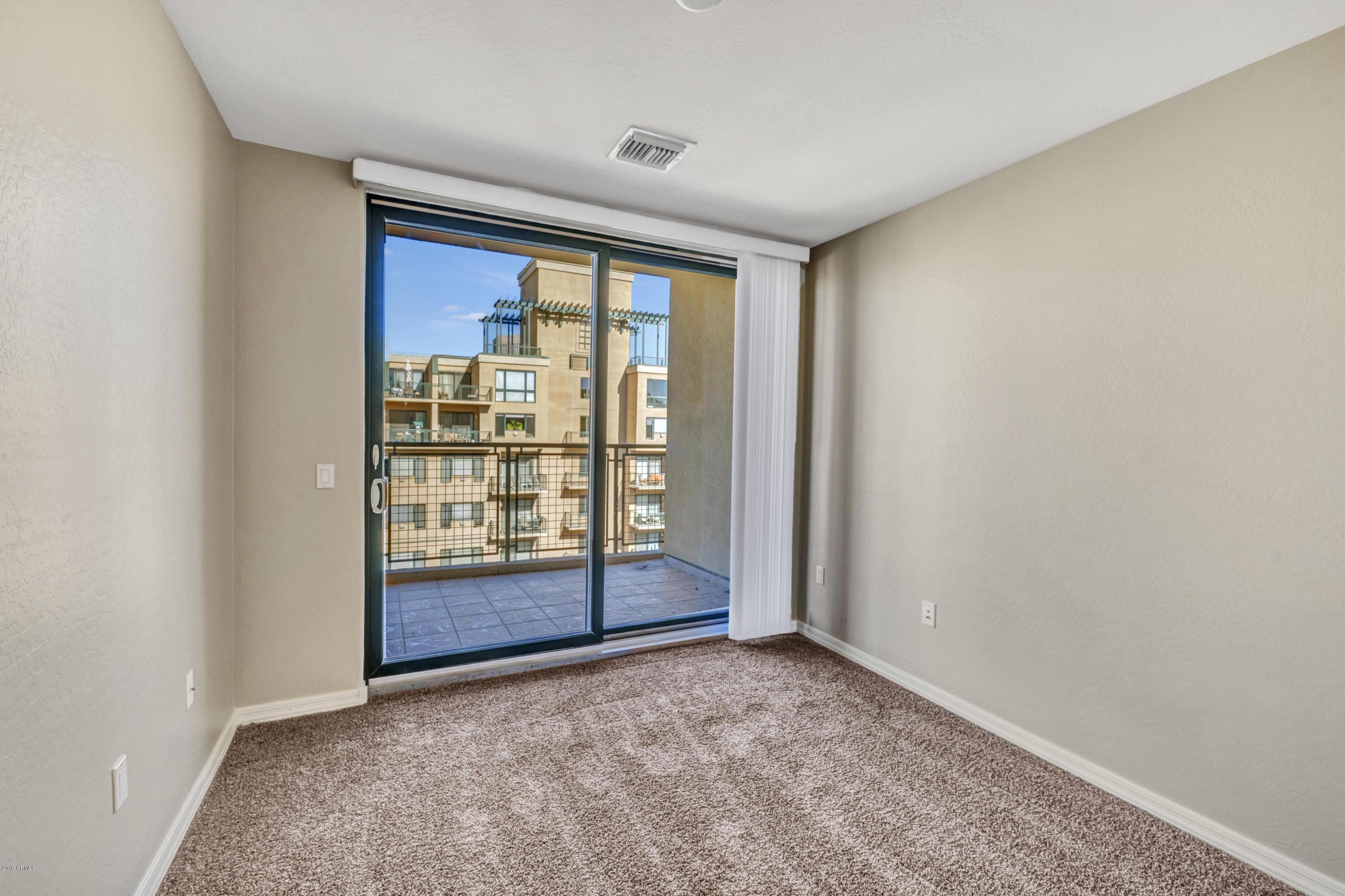 16 West Encanto Boulevard, Unit 615 Phoenix, AZ 85003 - Photo 9 of 33 a view of an empty room with balcony and a window