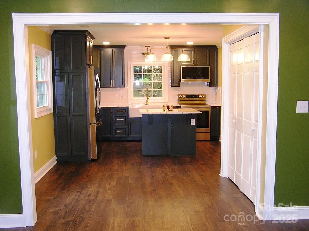 384 New River Heights Road, Unit 12 Boone, NC 28607 - Photo 11 of 30 a living room with stainless steel appliances furniture and a window