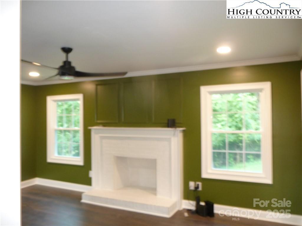 384 New River Heights Road, Unit 12 Boone, NC 28607 - Photo 13 of 30 a room with a fireplace and a window