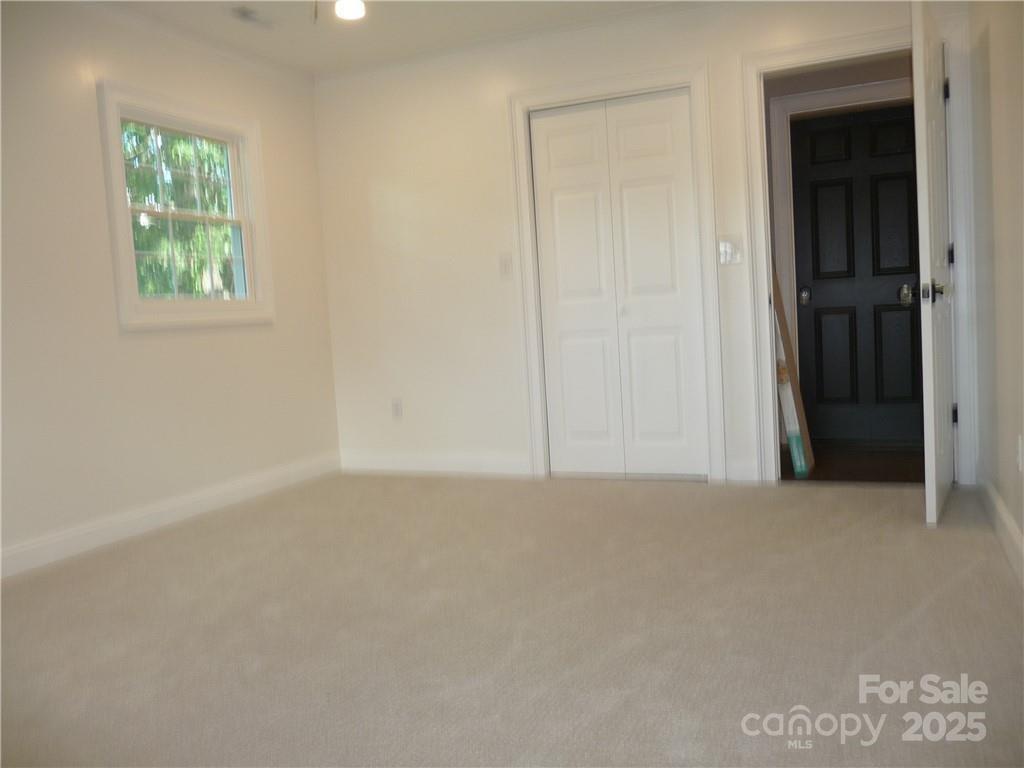384 New River Heights Road, Unit 12 Boone, NC 28607 - Photo 18 of 30 an empty room with windows and closet