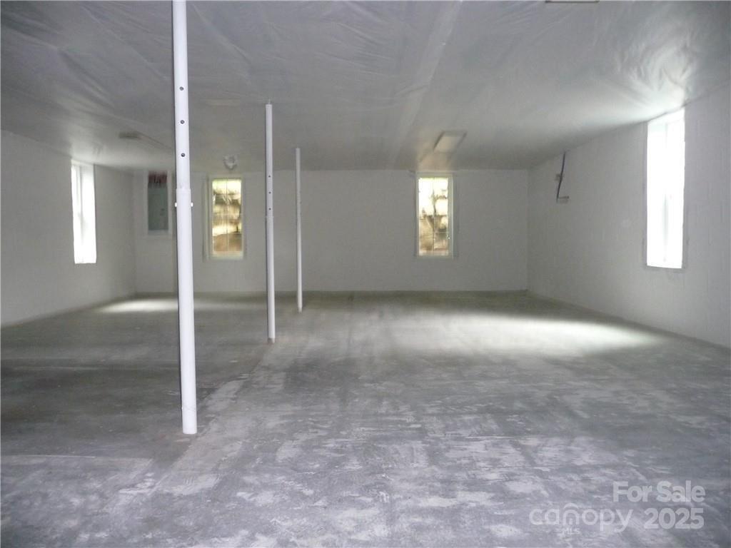 384 New River Heights Road, Unit 12 Boone, NC 28607 - Photo 24 of 30 en empty room with windows and entrance