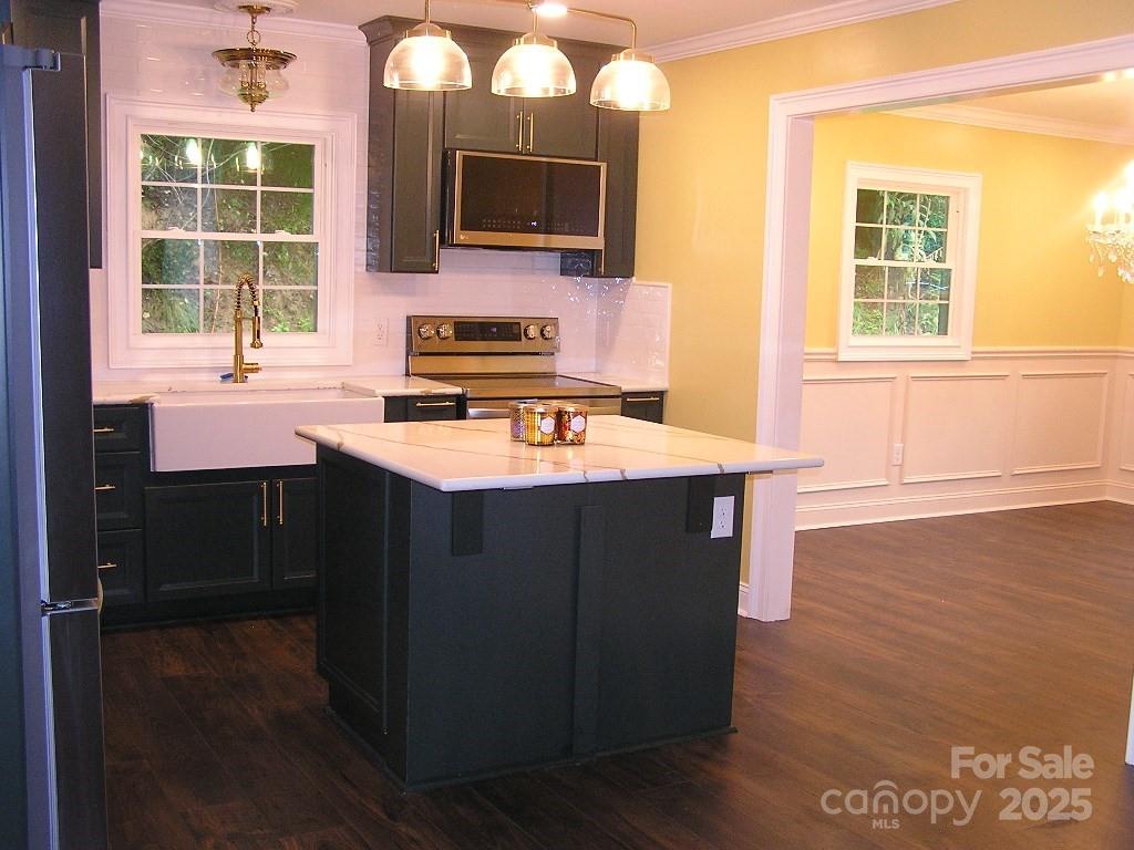 384 New River Heights Road, Unit 12 Boone, NC 28607 - Photo 8 of 30 a kitchen with a stove a sink and a microwave