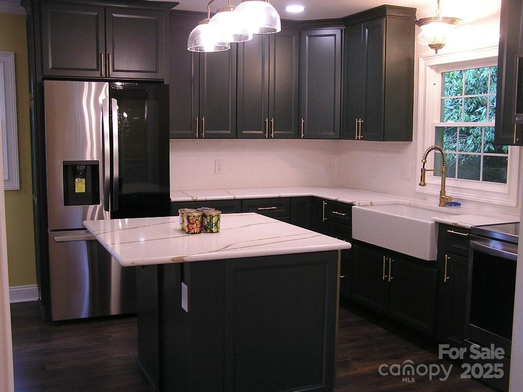 384 New River Heights Road, Unit 12 Boone, NC 28607 - Photo 10 of 30 a kitchen with a sink a refrigerator and cabinets