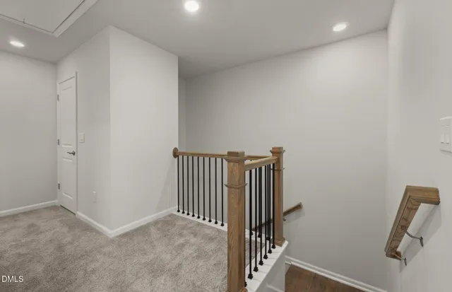 a view of a hallway with stairs