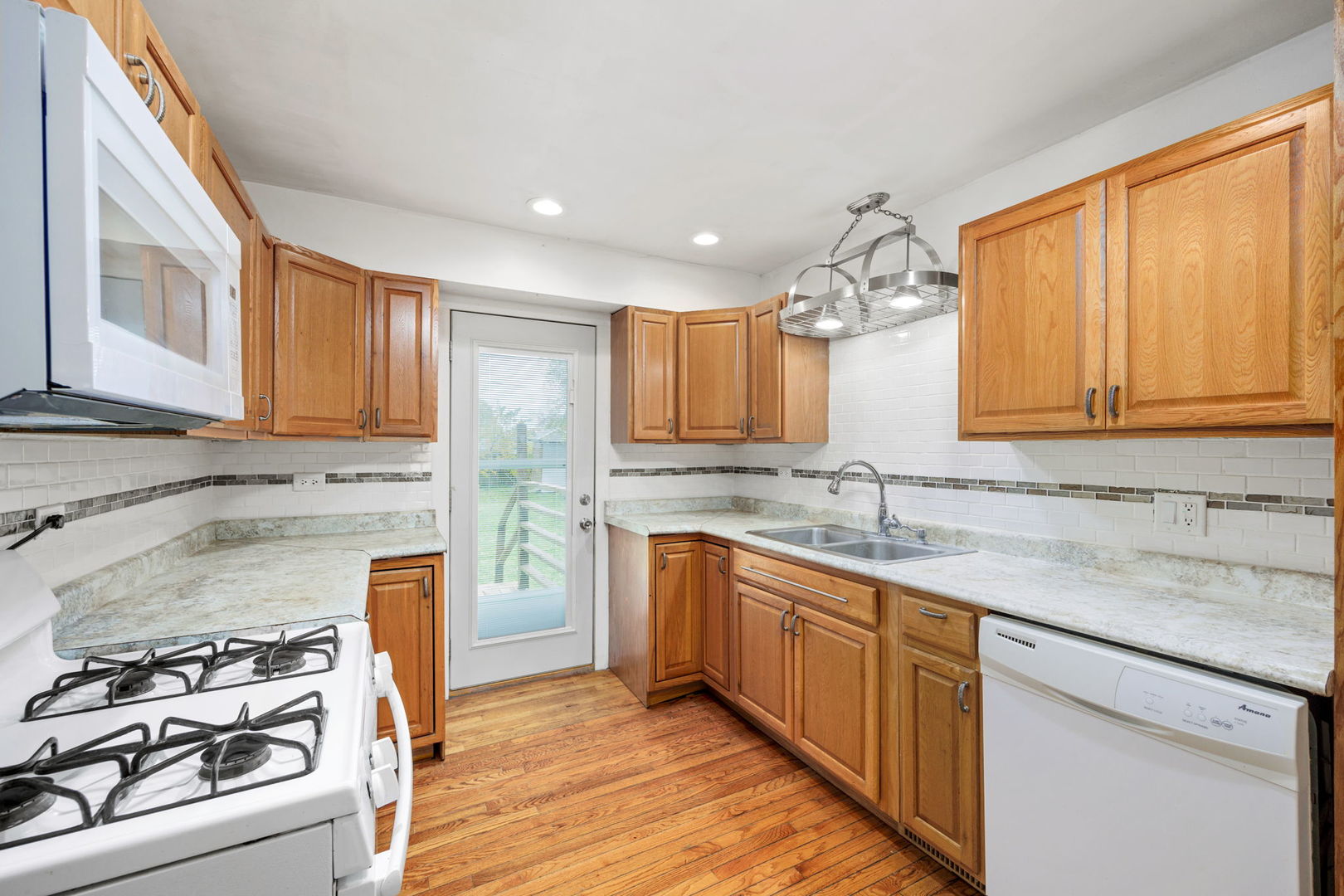 14 Deerpath Road Lake In The Hills, IL 60156 - Photo 11 of 30 a kitchen with stainless steel appliances granite countertop a sink stove and cabinets