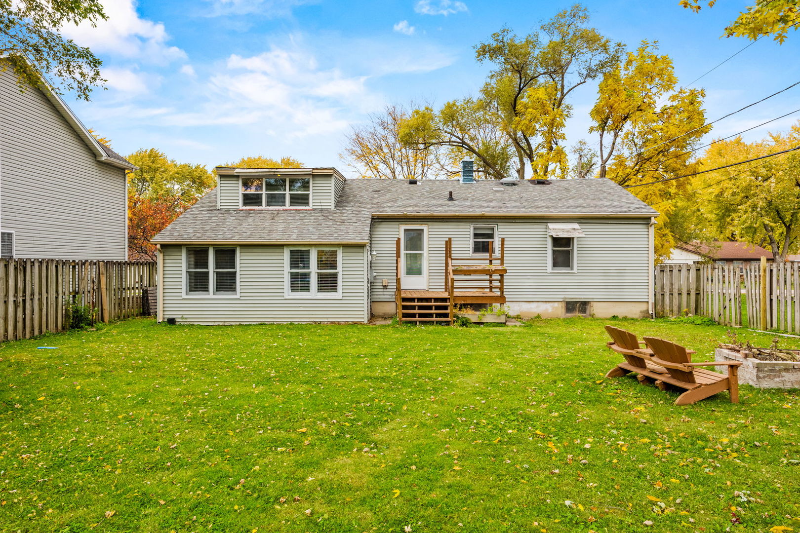14 Deerpath Road Lake In The Hills, IL 60156 - Photo 27 of 30 a backyard of a house with table and chairs