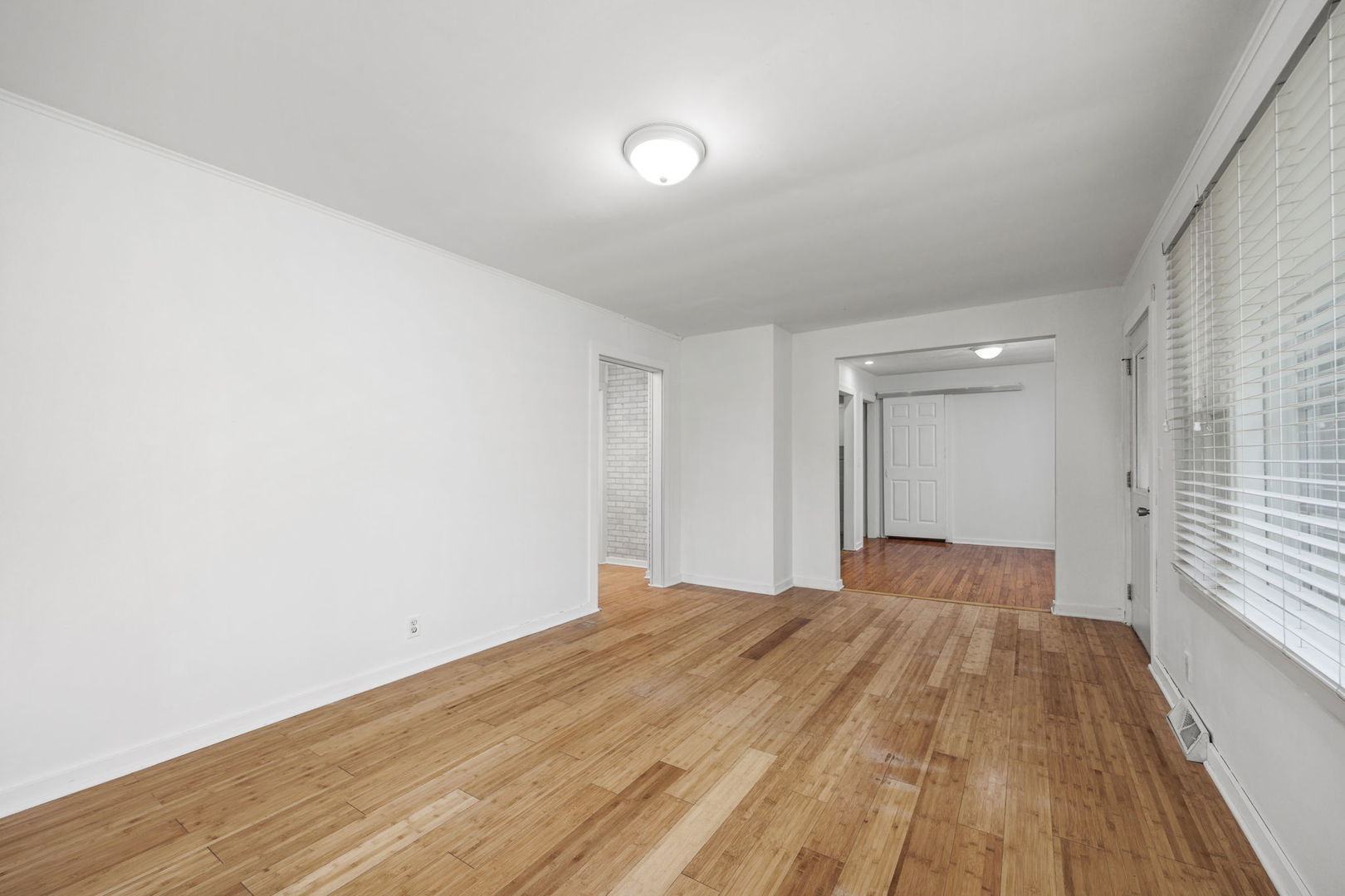 14 Deerpath Road Lake In The Hills, IL 60156 - Photo 6 of 30 a view of a big room with wooden floor and windows