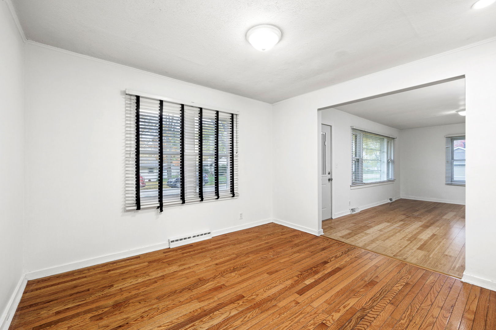 14 Deerpath Road Lake In The Hills, IL 60156 - Photo 8 of 30 a view of an empty room with wooden floor and a window