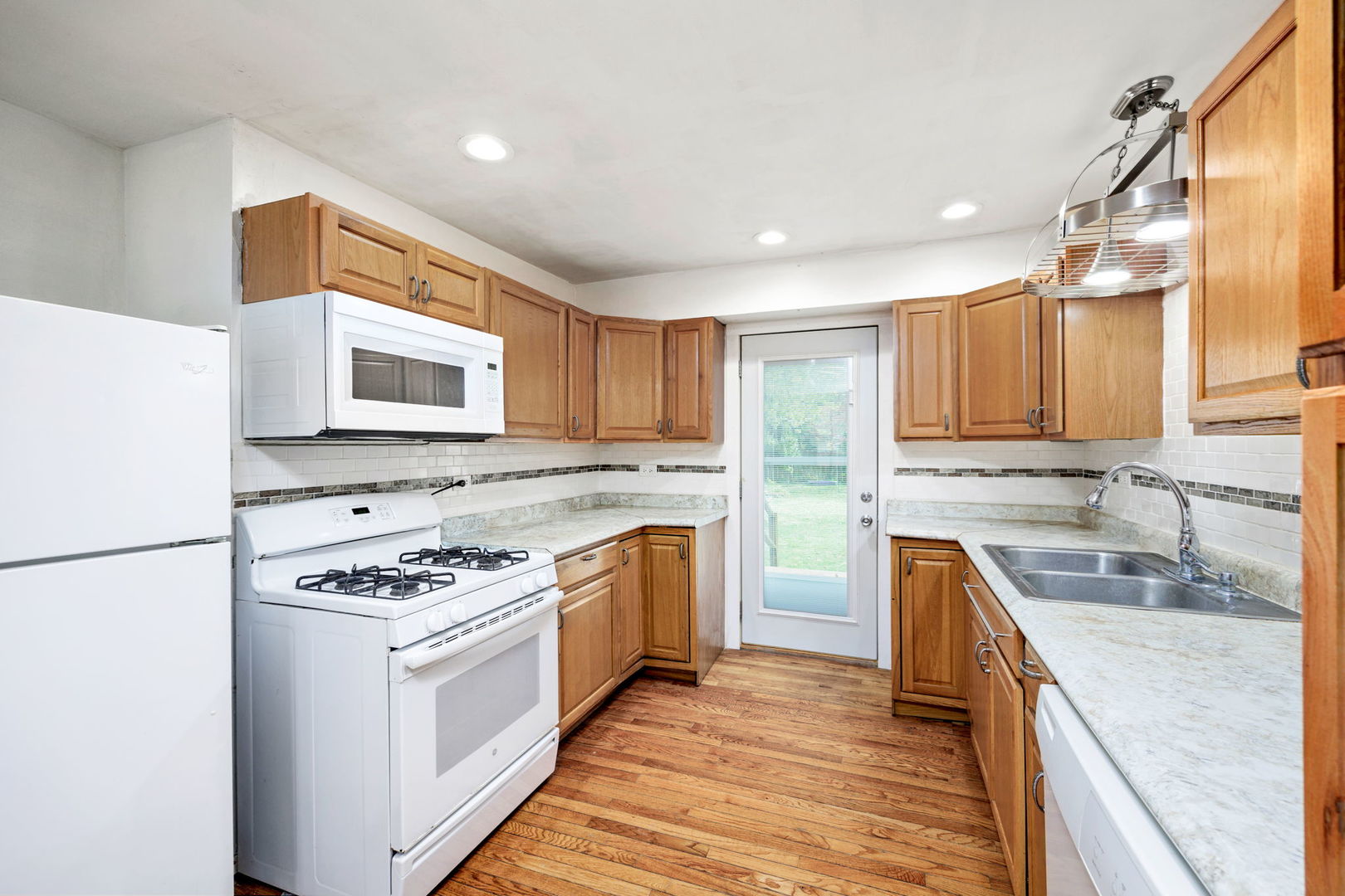 14 Deerpath Road Lake In The Hills, IL 60156 - Photo 10 of 30 a kitchen with stainless steel appliances granite countertop a stove a sink dishwasher and a refrigerator