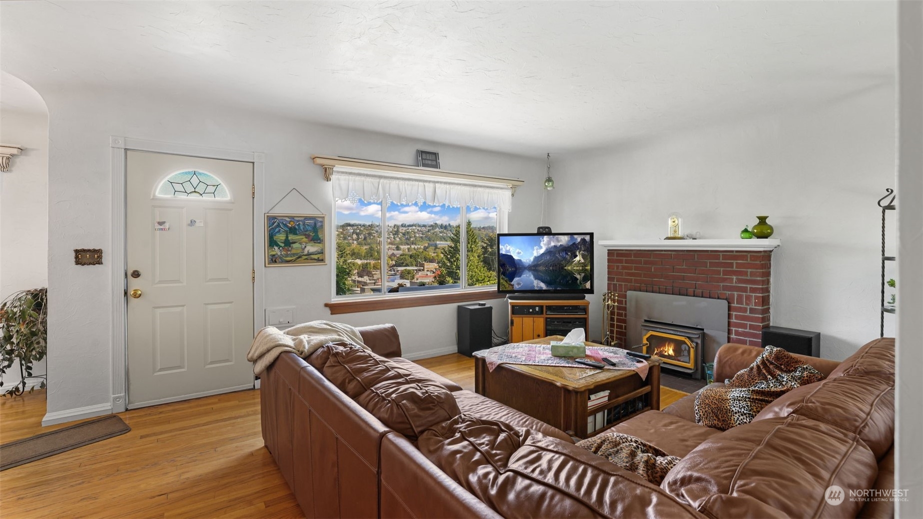 217 Hardie Avenue Southwest Renton, WA 98057 - Photo 4 of 29 a living room with furniture and a fireplace