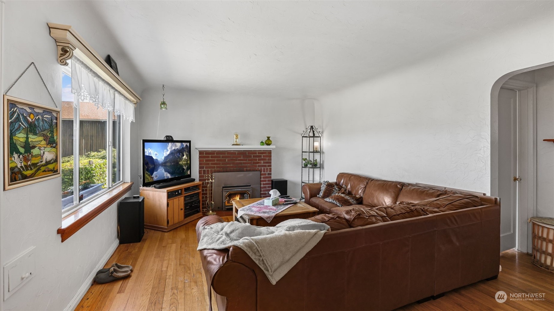217 Hardie Avenue Southwest Renton, WA 98057 - Photo 5 of 29 a living room with furniture a flat screen tv and a window