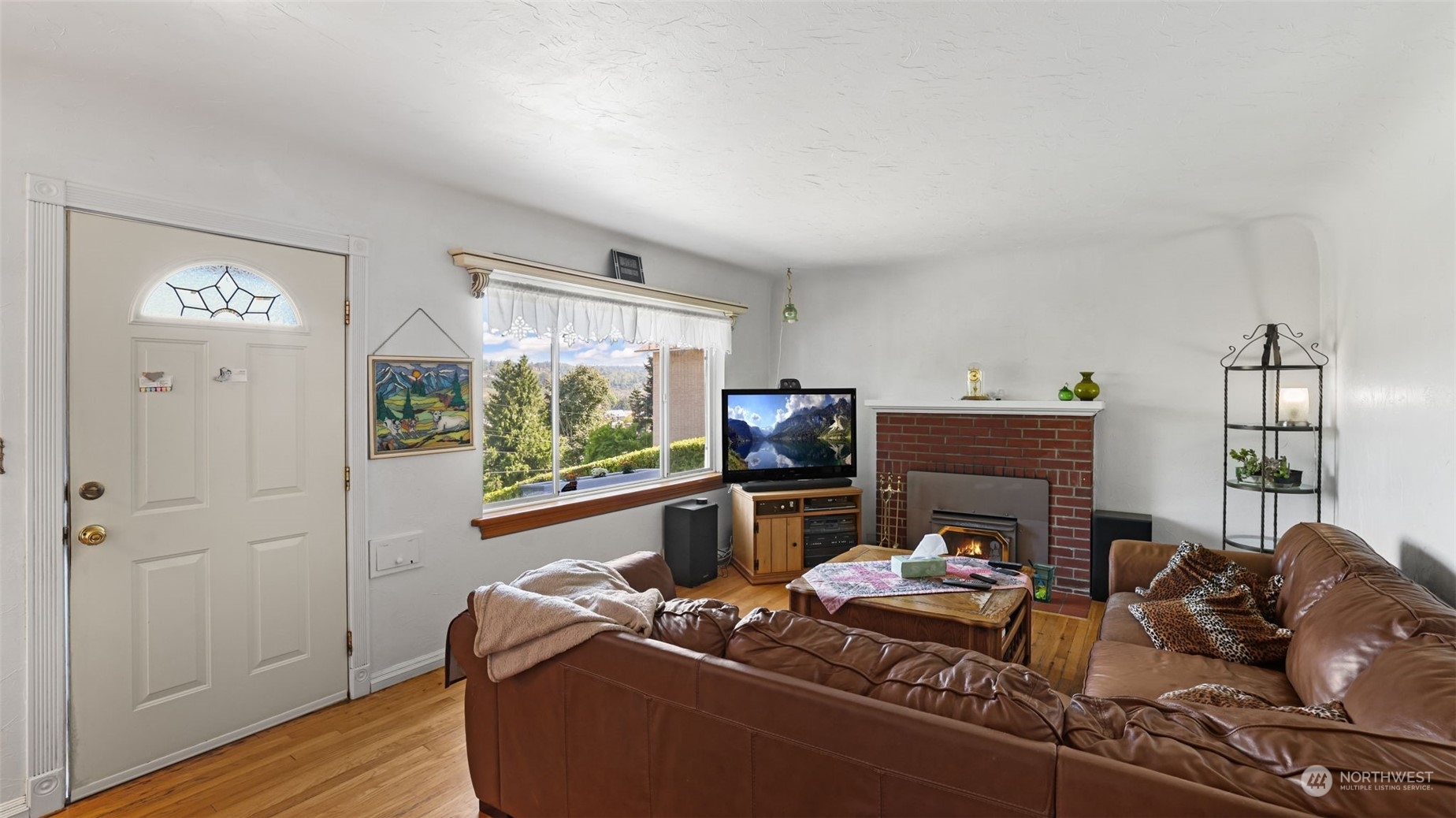 217 Hardie Avenue Southwest Renton, WA 98057 - Photo 6 of 29 a living room with furniture and a flat screen tv