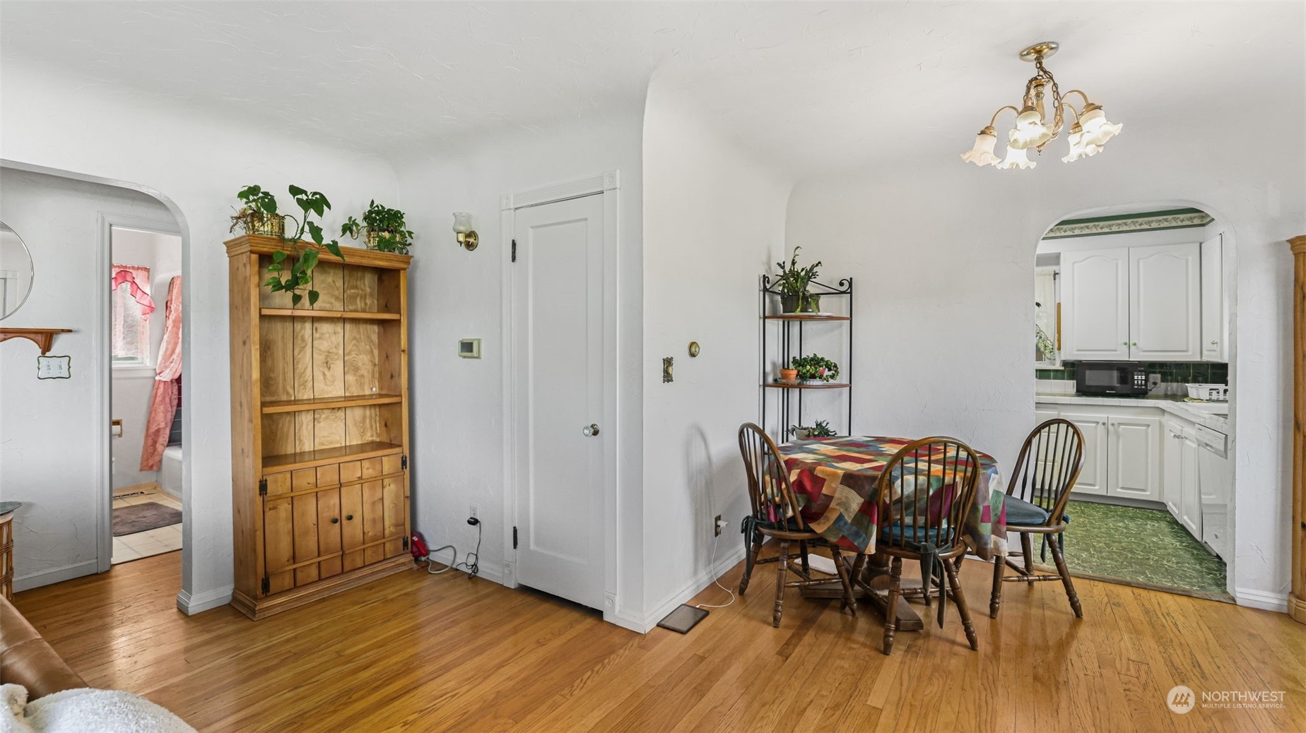 217 Hardie Avenue Southwest Renton, WA 98057 - Photo 7 of 29 a view of a dining room with furniture and wooden floor