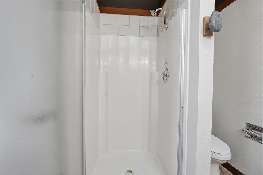 39 Graeagle Meadows Road, Unit 39 Graeagle, CA 96103 - Photo 25 of 48 a bathroom with a shower and a toilet