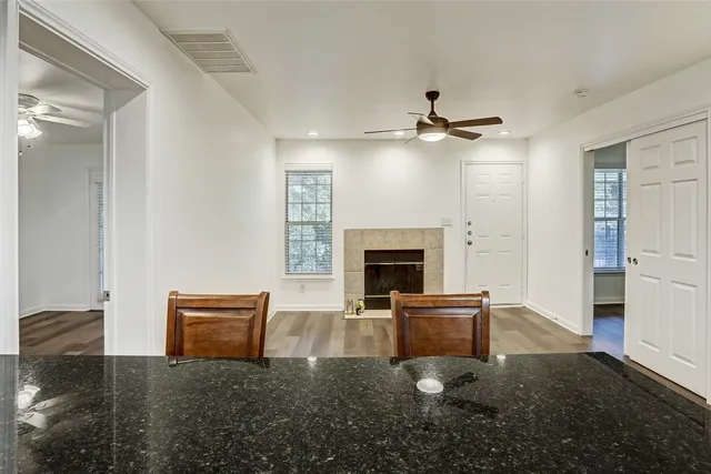 a kitchen with granite countertop a sink and a stove