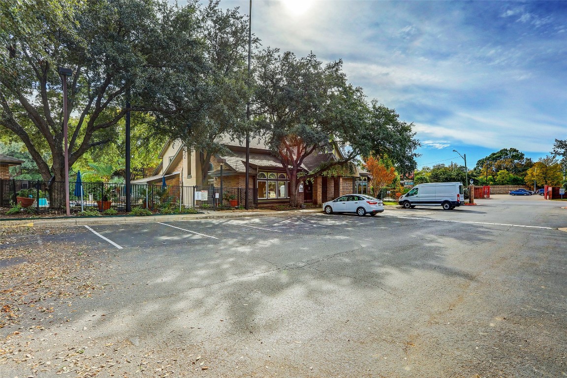 7685 Northcross Drive, Unit 426 Austin, TX 78757 - Photo 28 of 35 a view of road with parked cars